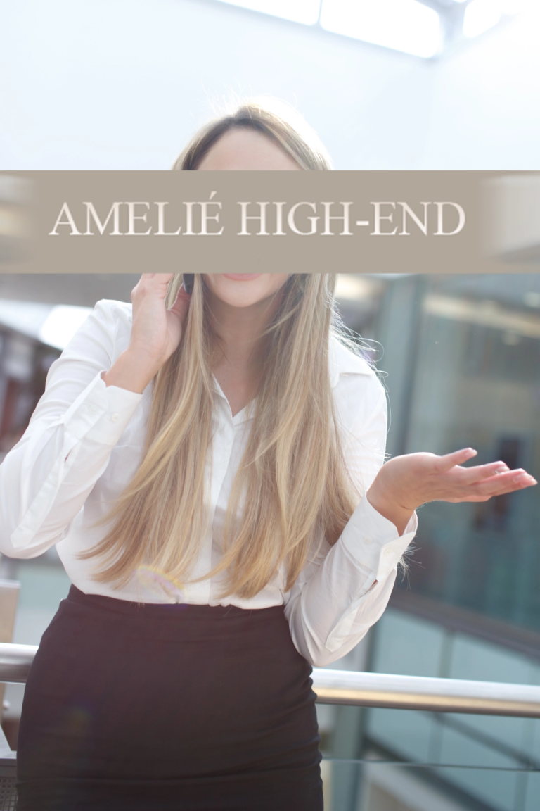 High Class Escort Berlin mit langen Haaren in einem weißen Hemd und schwarzer Hose, lächelt und gestikuliert.
